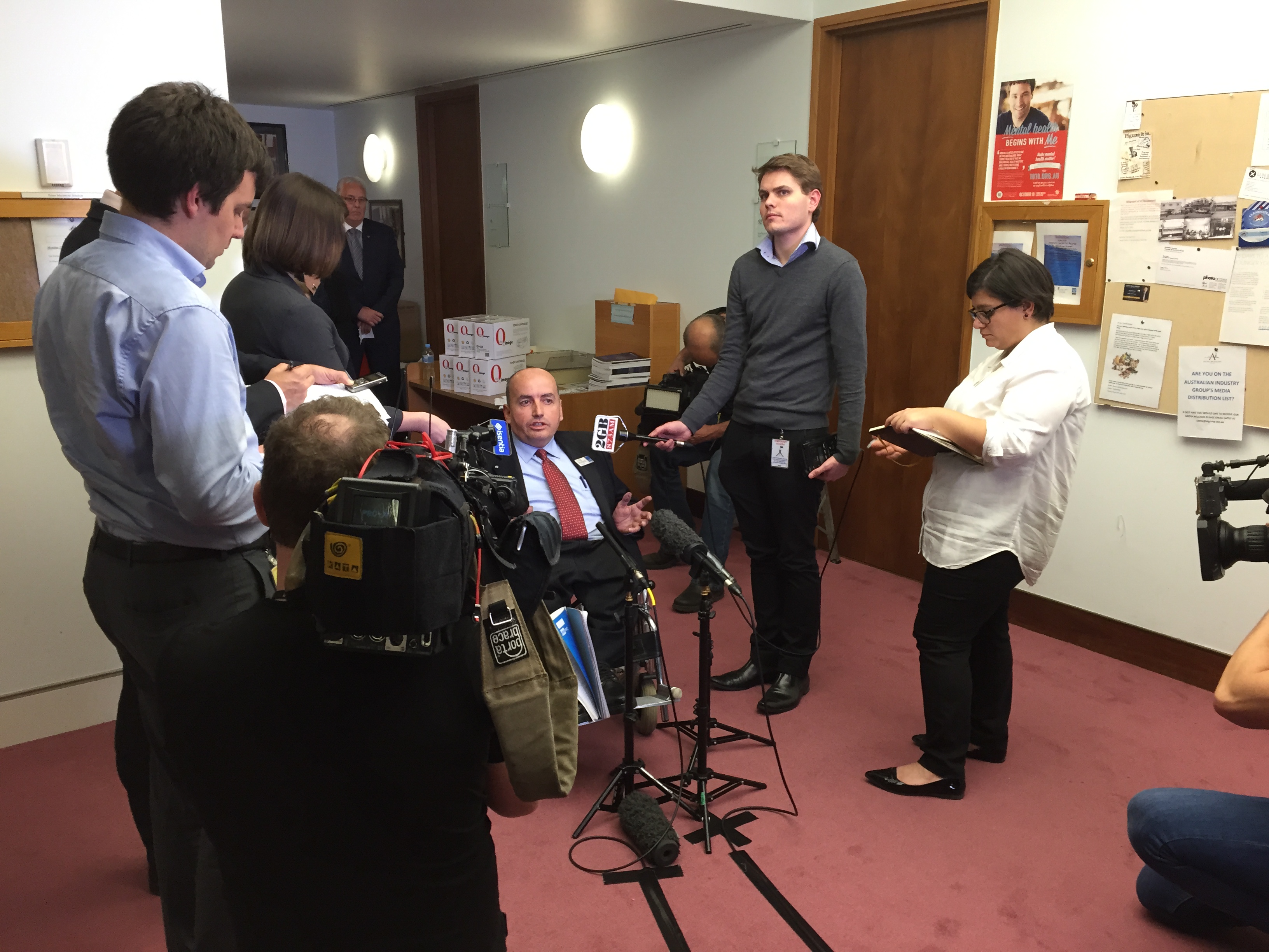 IMAGE: People with Disability Australia President Craig Wallace answering questions from TV, newspaper and radio journalists about the 2015 Federal Budget